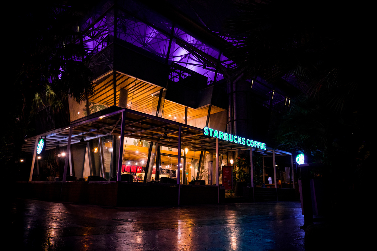 A Low Ange Shot of a Starbucks Building at Night